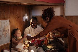 A diverse family enjoying bedtime reading together with a warm atmosphere.